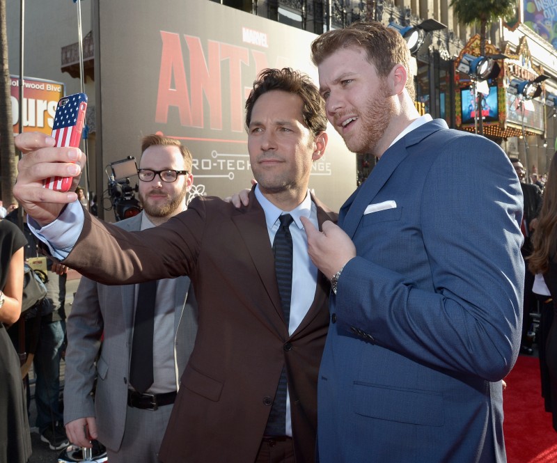 LOS ANGELES, CA - JUNE 29: Actor Paul Rudd (C) takes a selfie at the OMAZE booth at the world premiere of Marvel's "Ant-Man" at The Dolby Theatre on June 29, 2015 in Los Angeles, California. (Photo by Charley Gallay/Getty Images) *** Local Caption *** Paul Rudd